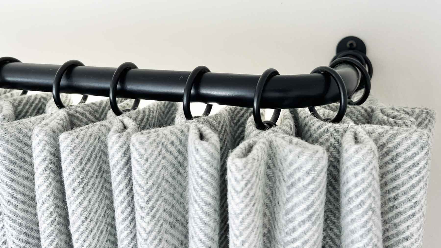 french curtain pole with wool herringbone curtains