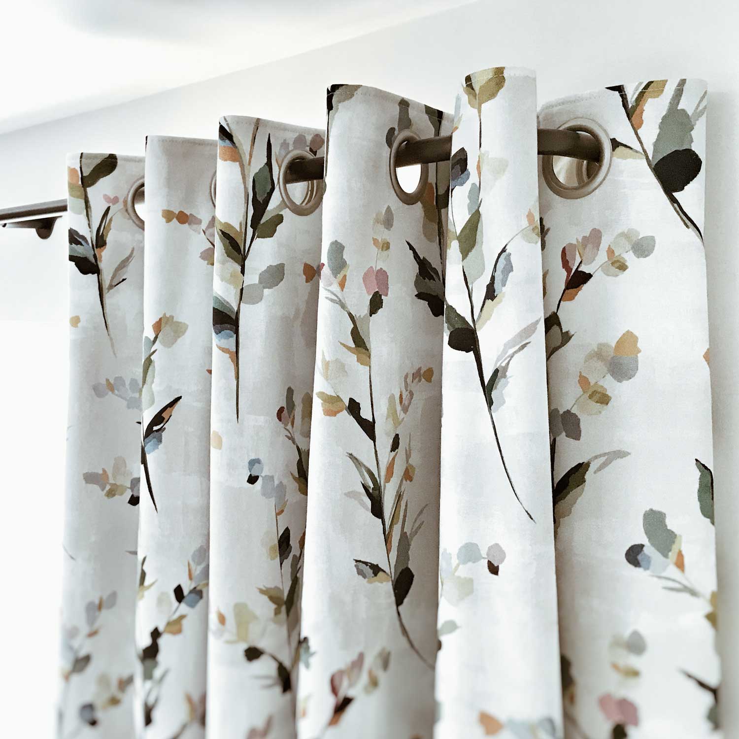 Blackout eyelet curtains on a French curtain pole to block light in the bedroom