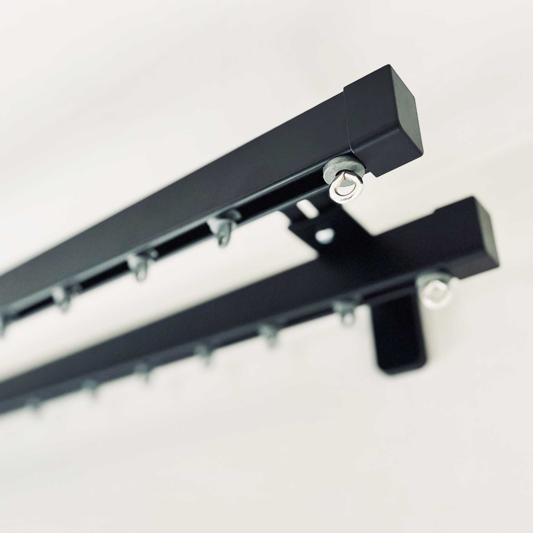Square30 double curtain track with Cap finials in black metal finish. Ideal for heavy extra long curtains.